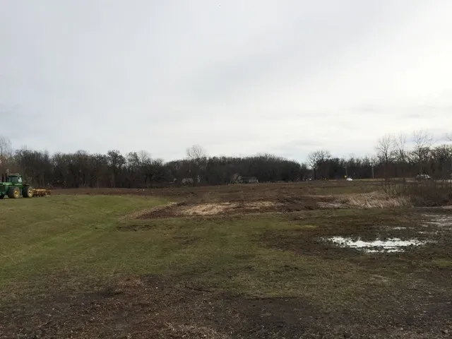 a view of lake with green space