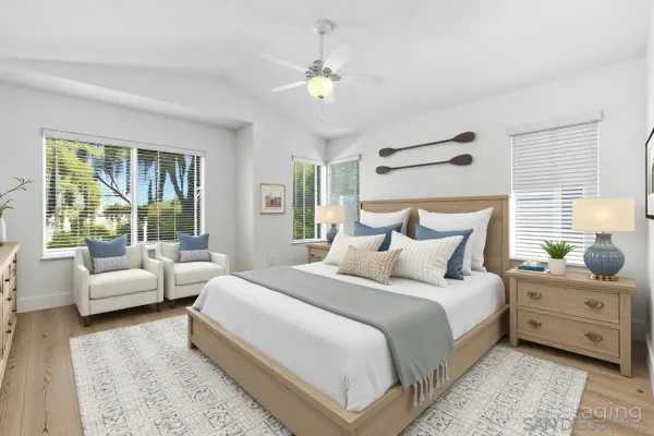 a bedroom with bed and windows