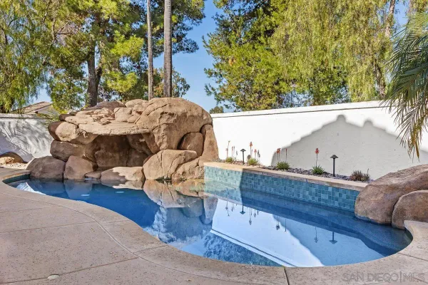 a view of a couches and dinning table and chairs in the patio