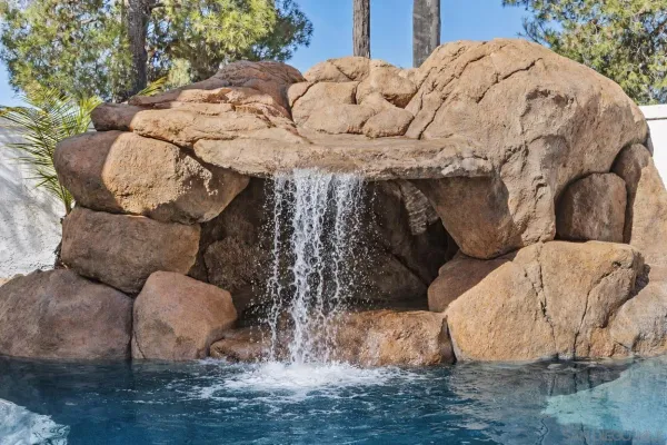 a view of a patio with table and chairs and potted plants