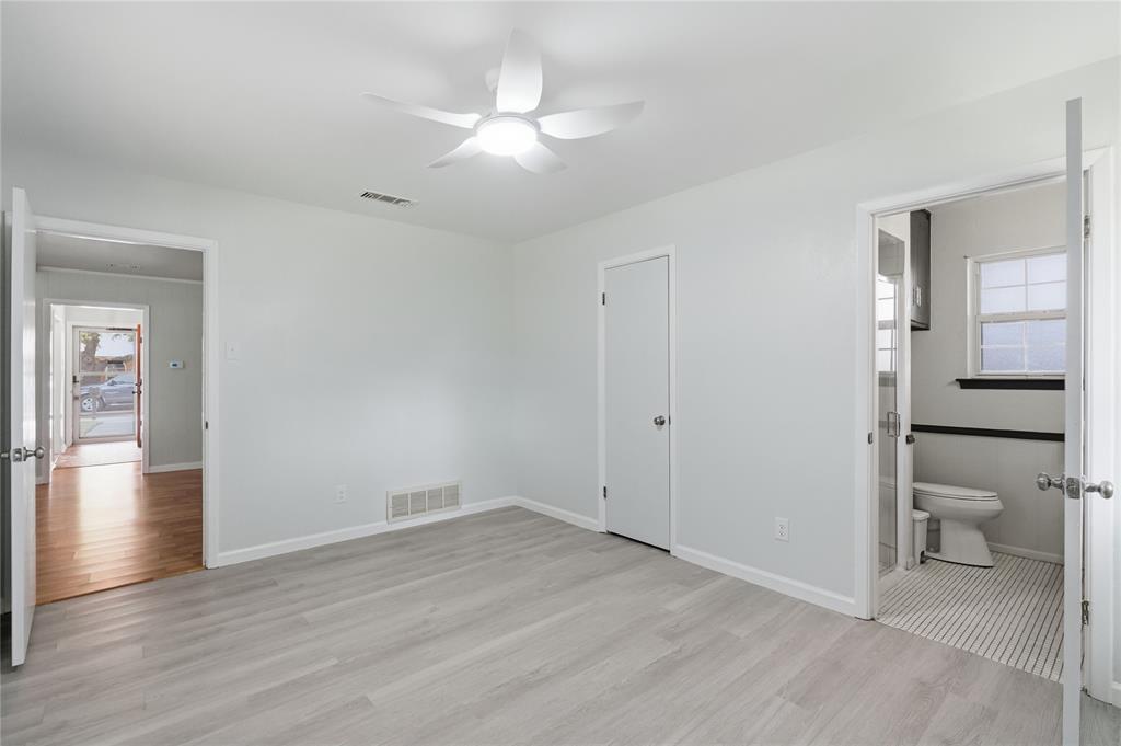 837 Springdale Road Bedford, TX 76021 - Photo 21 of 28 Interior room featuring light wood-finish flooring and a ceiling fan with integrated lighting