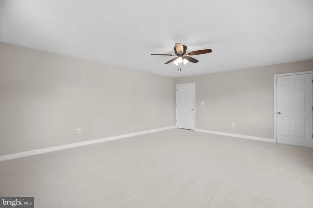 a kitchen with granite countertop a stove and a microwave