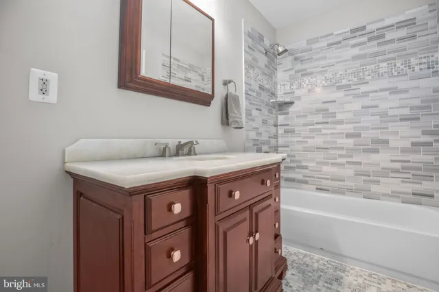 a view of a field with trees in the background