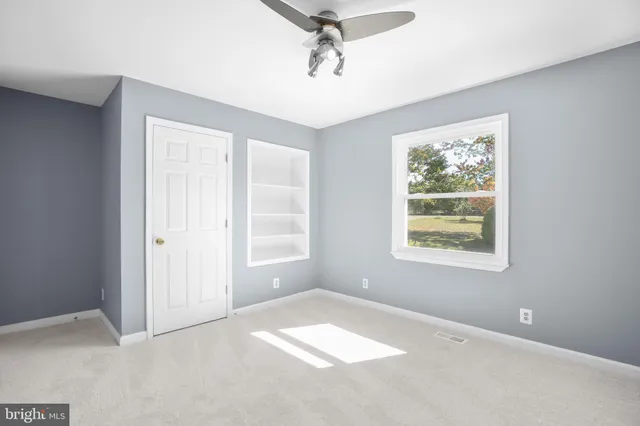 an aerial view of waterside residential houses with outdoor space