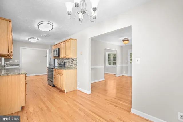 an aerial view of a house with a swimming pool