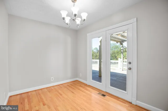 an aerial view of a house with outdoor space