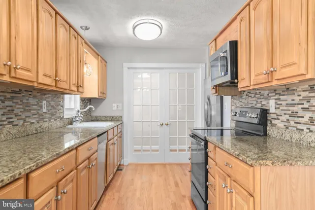 an aerial view of house with yard swimming pool and outdoor seating