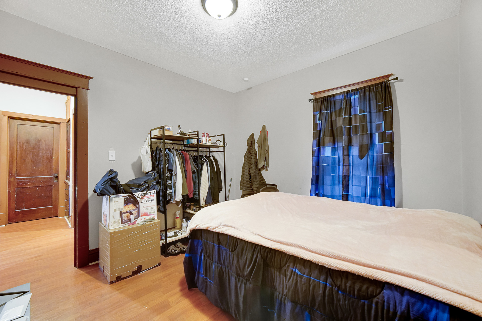511 3rd Avenue Joliet, IL 60433 - Photo 11 of 30 a bedroom with a bed and a mirror