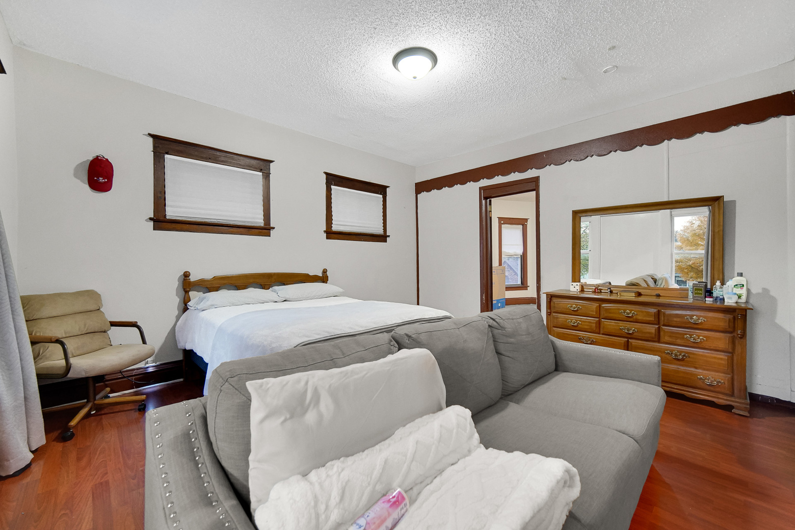 511 3rd Avenue Joliet, IL 60433 - Photo 16 of 30 a bedroom with furniture and a wooden floor