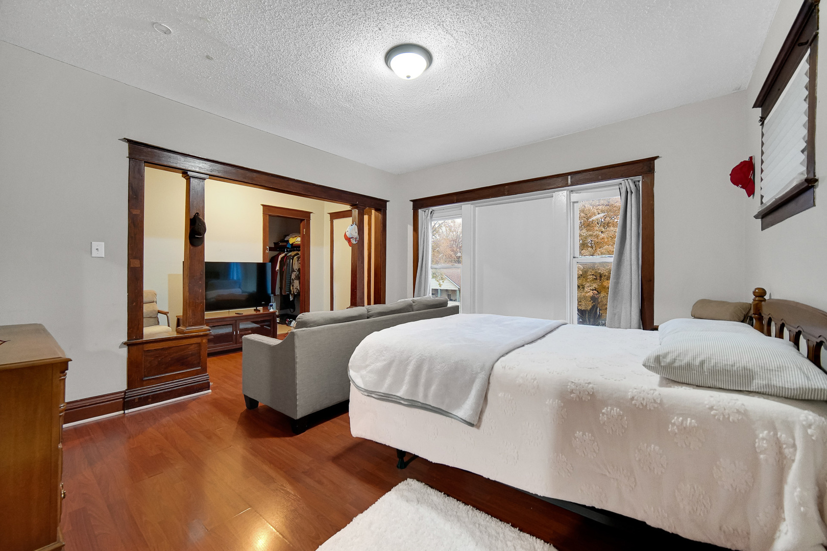 511 3rd Avenue Joliet, IL 60433 - Photo 18 of 30 a bedroom with a large bed and a large window