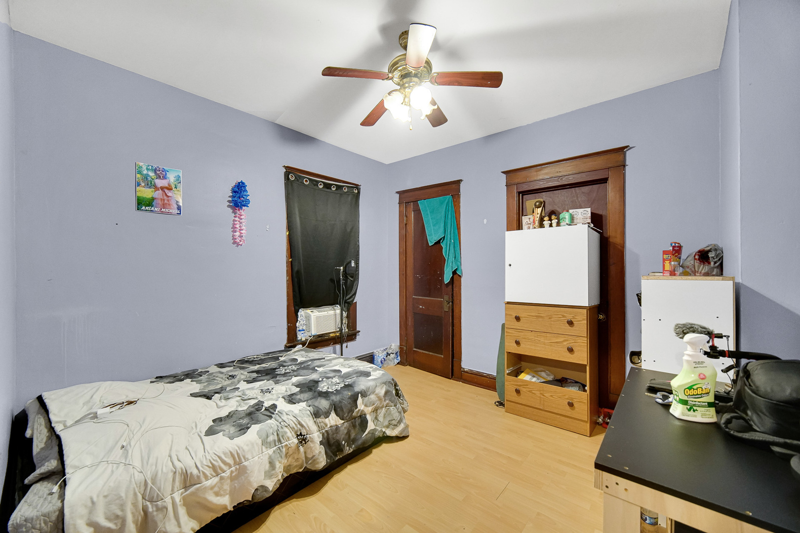 511 3rd Avenue Joliet, IL 60433 - Photo 24 of 30 a bedroom that has a bed and a chandelier