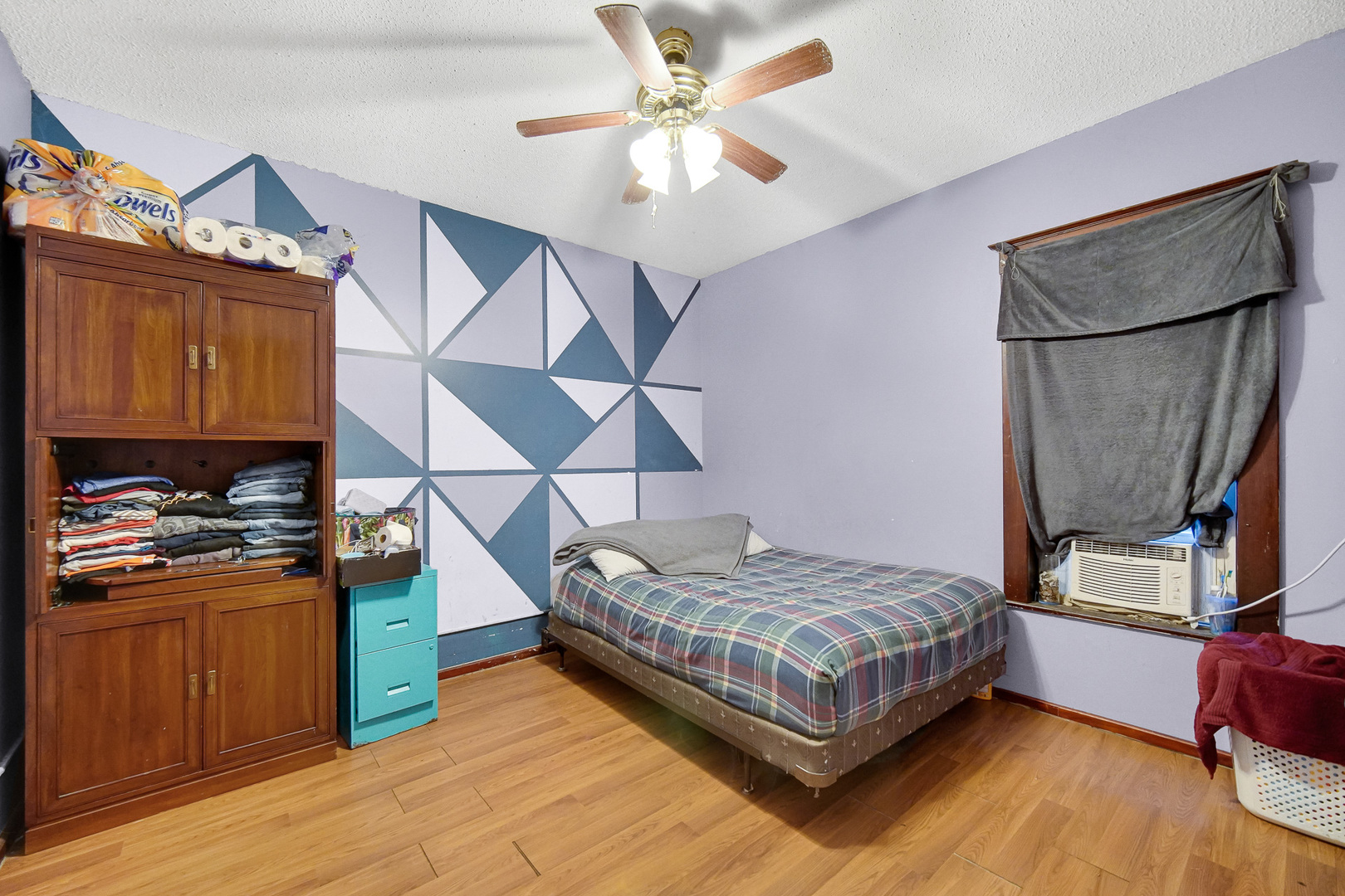 511 3rd Avenue Joliet, IL 60433 - Photo 25 of 30 a bedroom with a bed and wooden floor