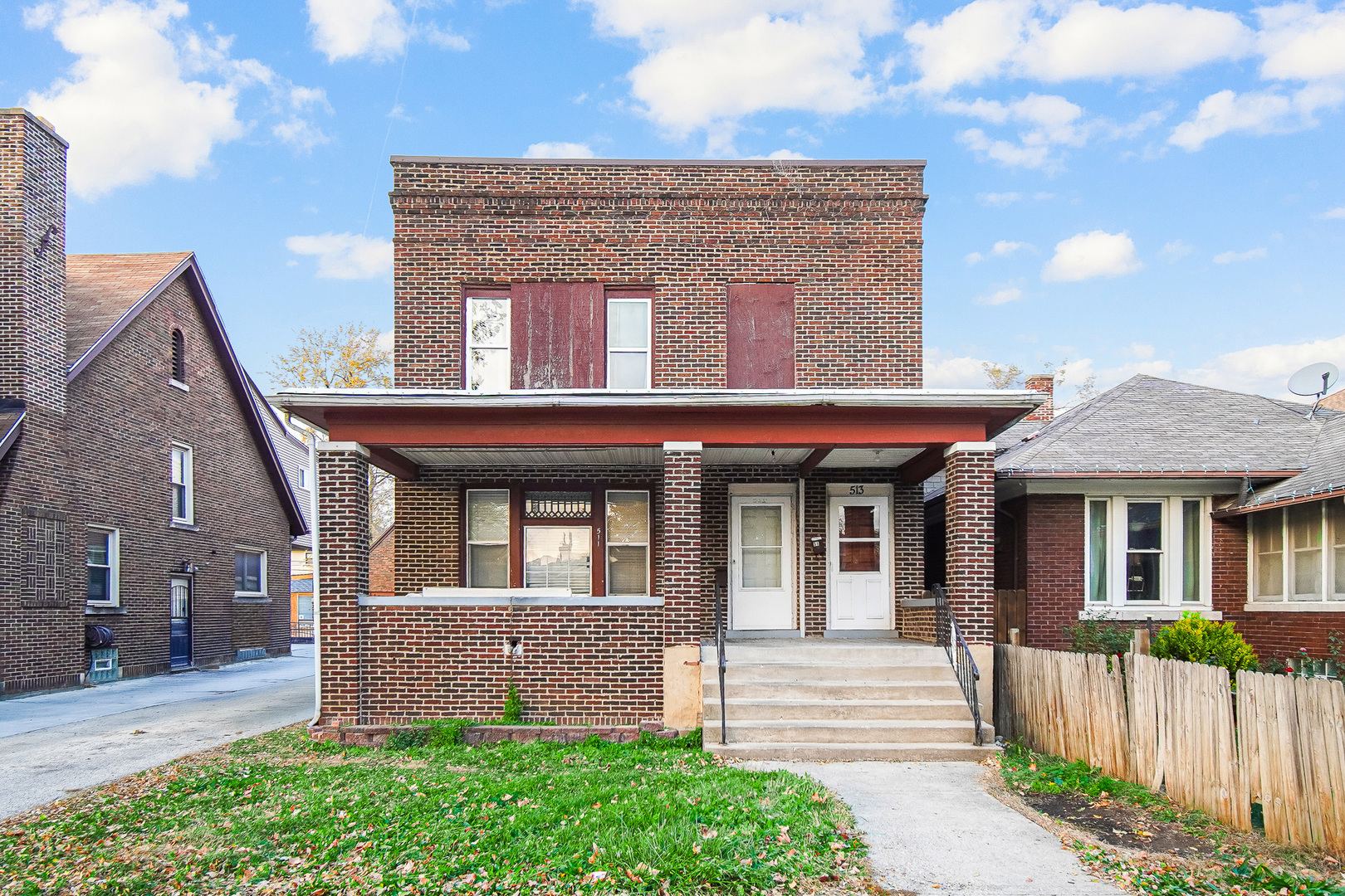 511 3rd Avenue Joliet, IL 60433 - Photo 3 of 30 a front view of a house with a garden
