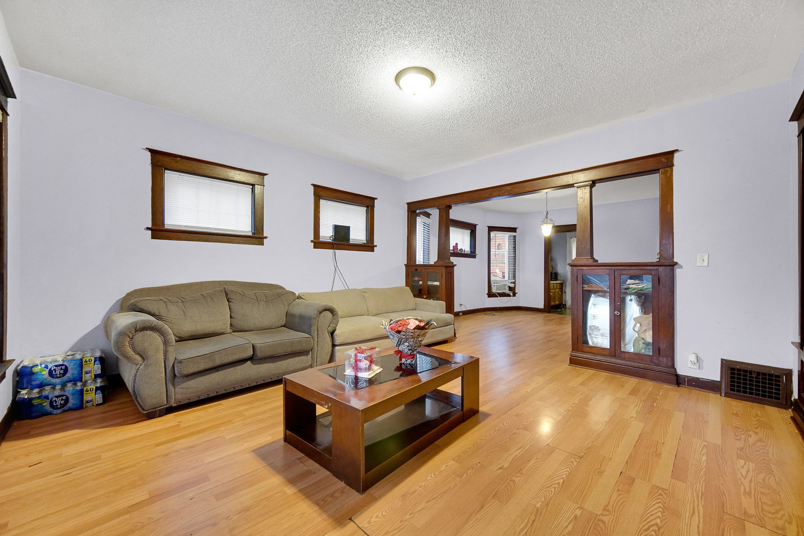 511 3rd Avenue Joliet, IL 60433 - Photo 6 of 30 a living room with furniture and a wooden floor