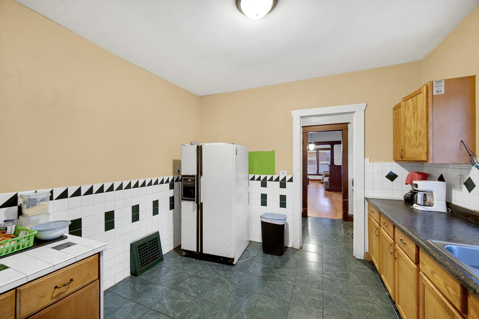 511 3rd Avenue Joliet, IL 60433 - Photo 9 of 30 a view of a kitchen with fridge and workspace