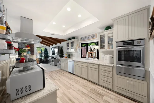 a kitchen with sink cabinets and microwave