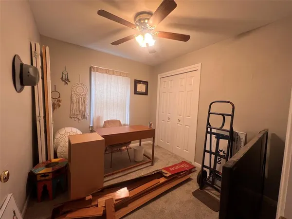 a view of workspace with wooden floor windows
