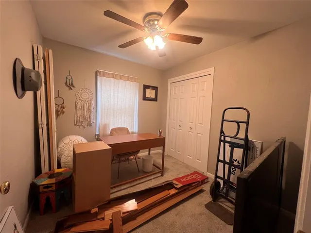 a view of workspace with wooden floor windows