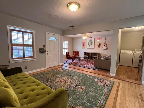 a living room with furniture and a rug
