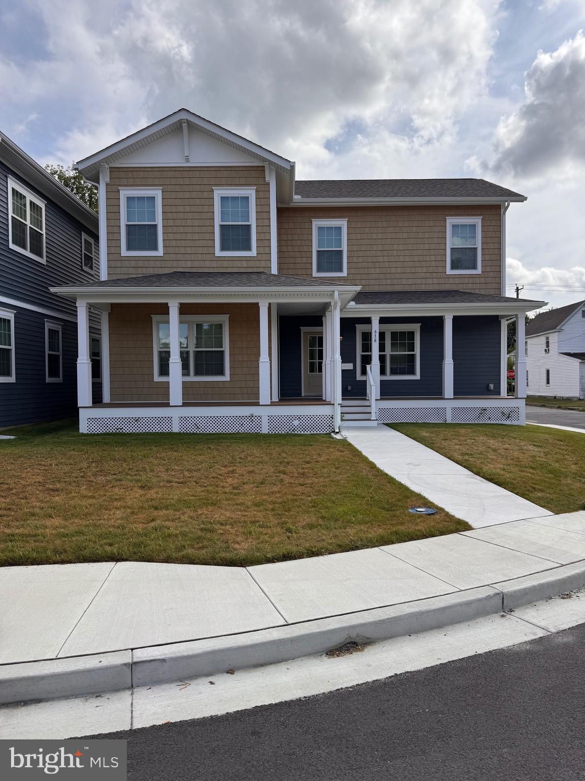 a view of a brick house with large windows