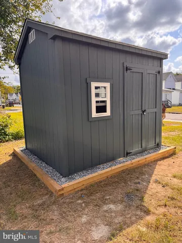 a view of a patio with table and chairs