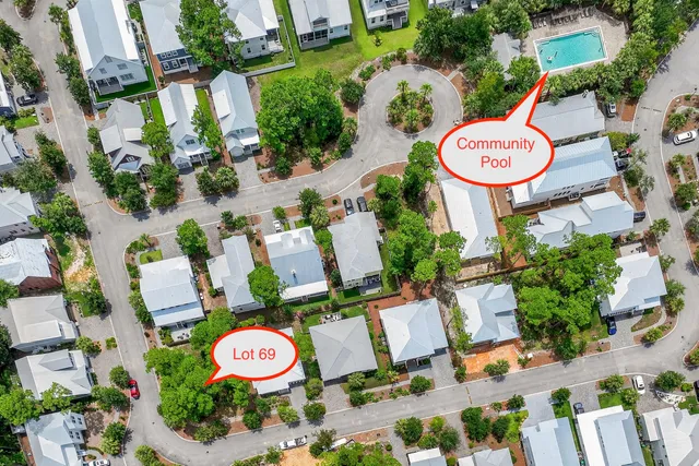 an aerial view of a swimming pool patio fire pit and outdoor seating