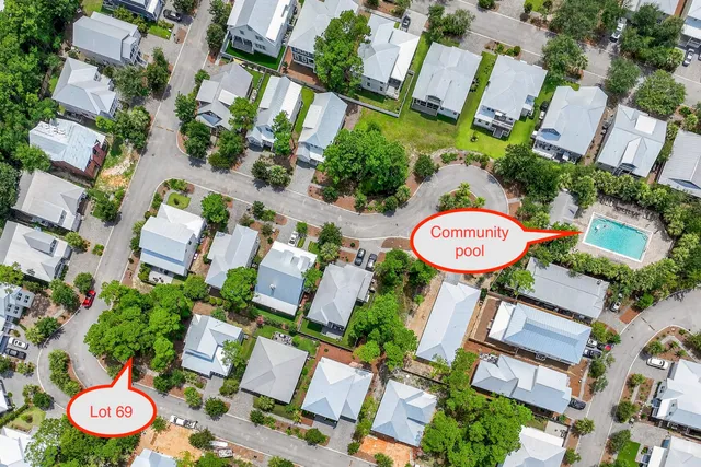 an aerial view of a swimming pool patio and outdoor seating