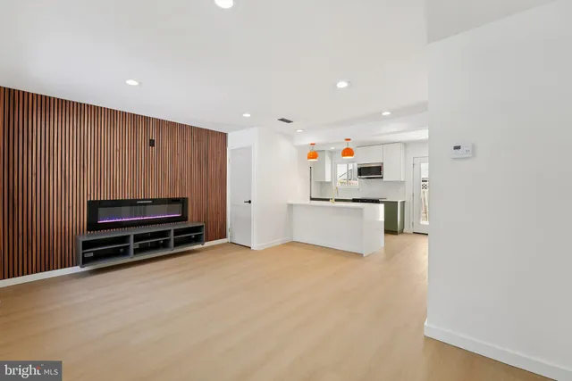 a view of kitchen and refrigerator