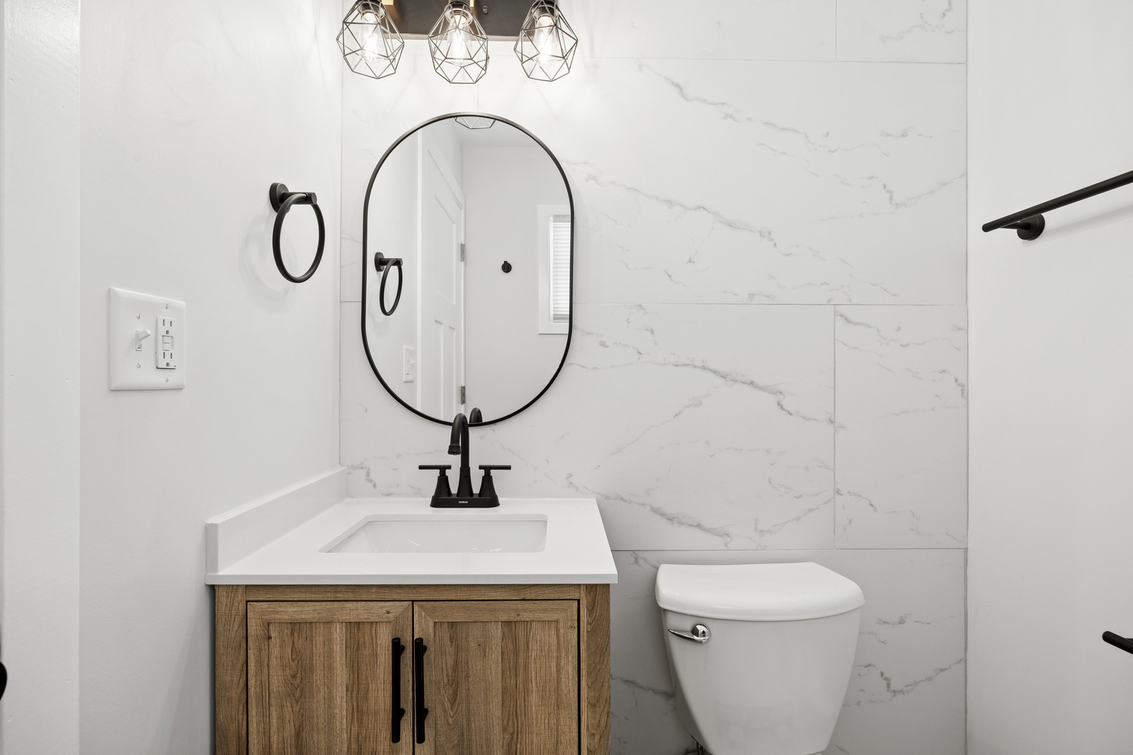 570 Andover Street Chicago Heights, IL 60411 - Photo 14 of 22 a bathroom with a sink and a mirror