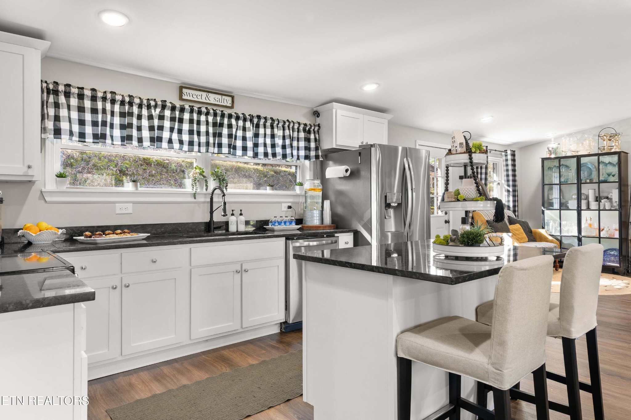 507 Short Street Athens, TN 37303 - Photo 17 of 54 a kitchen with stainless steel appliances granite countertop a sink refrigerator and cabinets