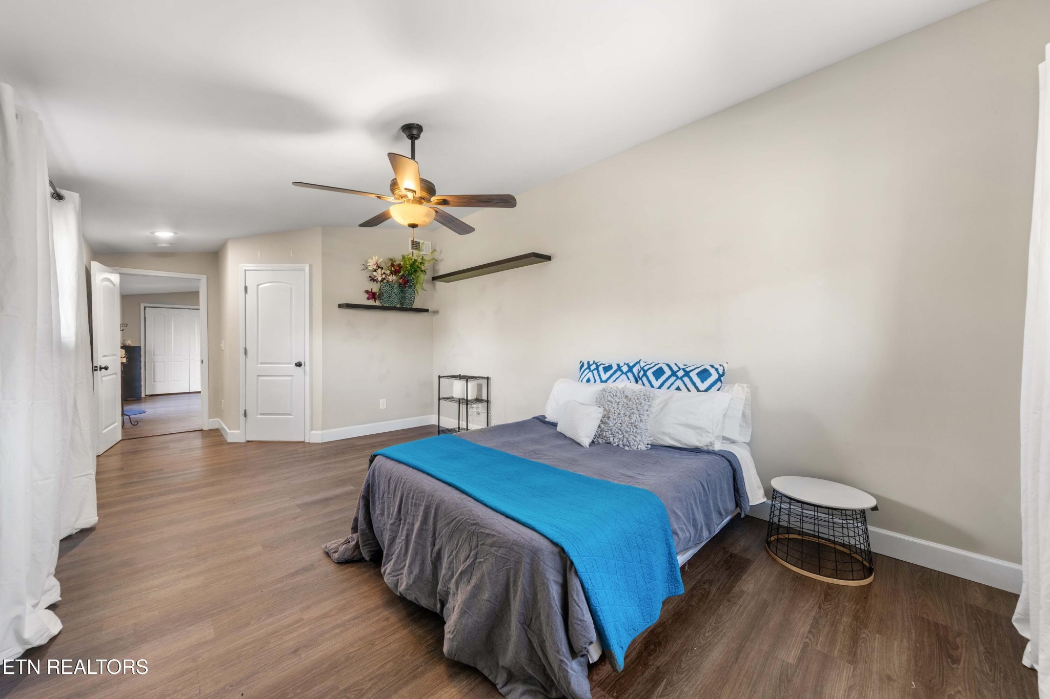 507 Short Street Athens, TN 37303 - Photo 35 of 54 a bedroom with a bed and a chandelier