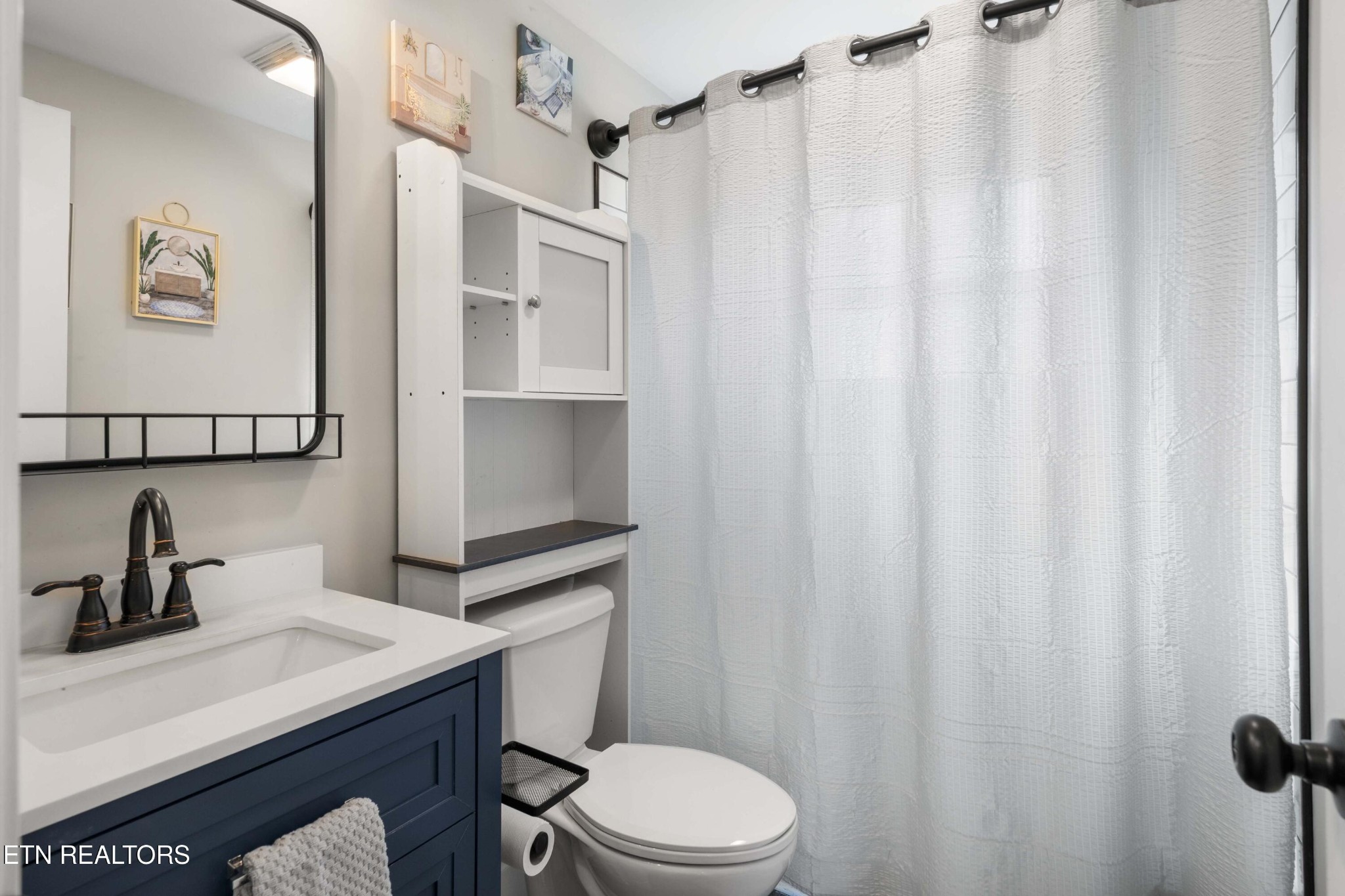 507 Short Street Athens, TN 37303 - Photo 37 of 54 a bathroom with a sink toilet and shower