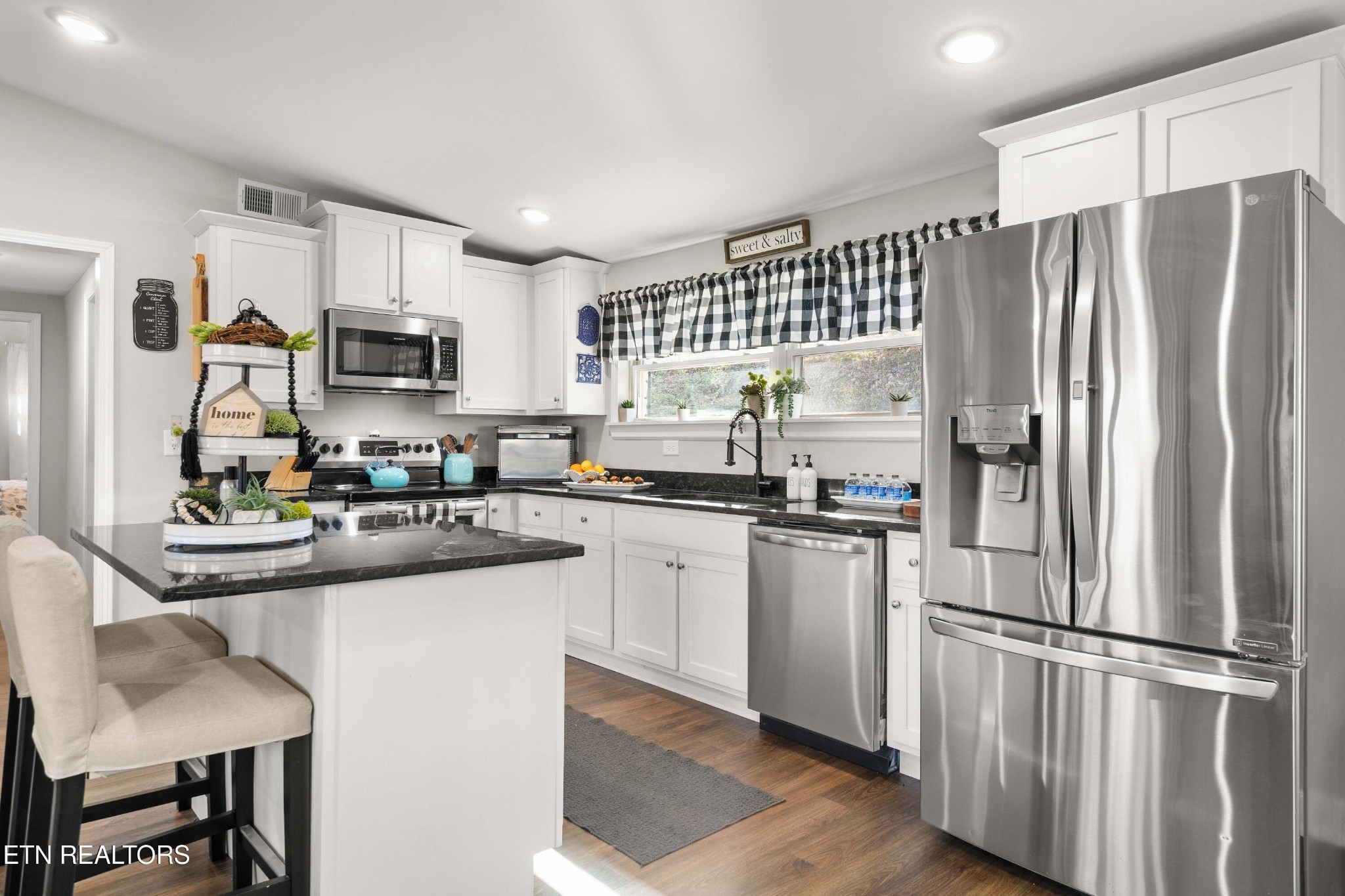 507 Short Street Athens, TN 37303 - Photo 4 of 54 a kitchen with kitchen island a counter top space stainless steel appliances and cabinets