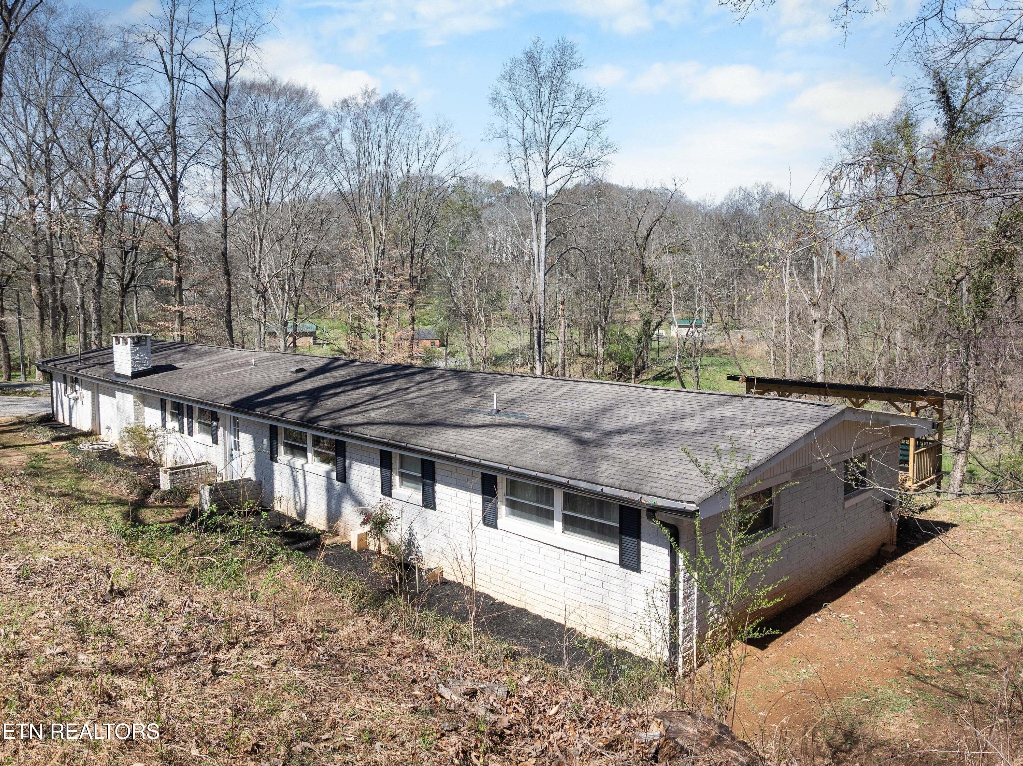 507 Short Street Athens, TN 37303 - Photo 51 of 54 a view of a wooden table and chairs on the roof