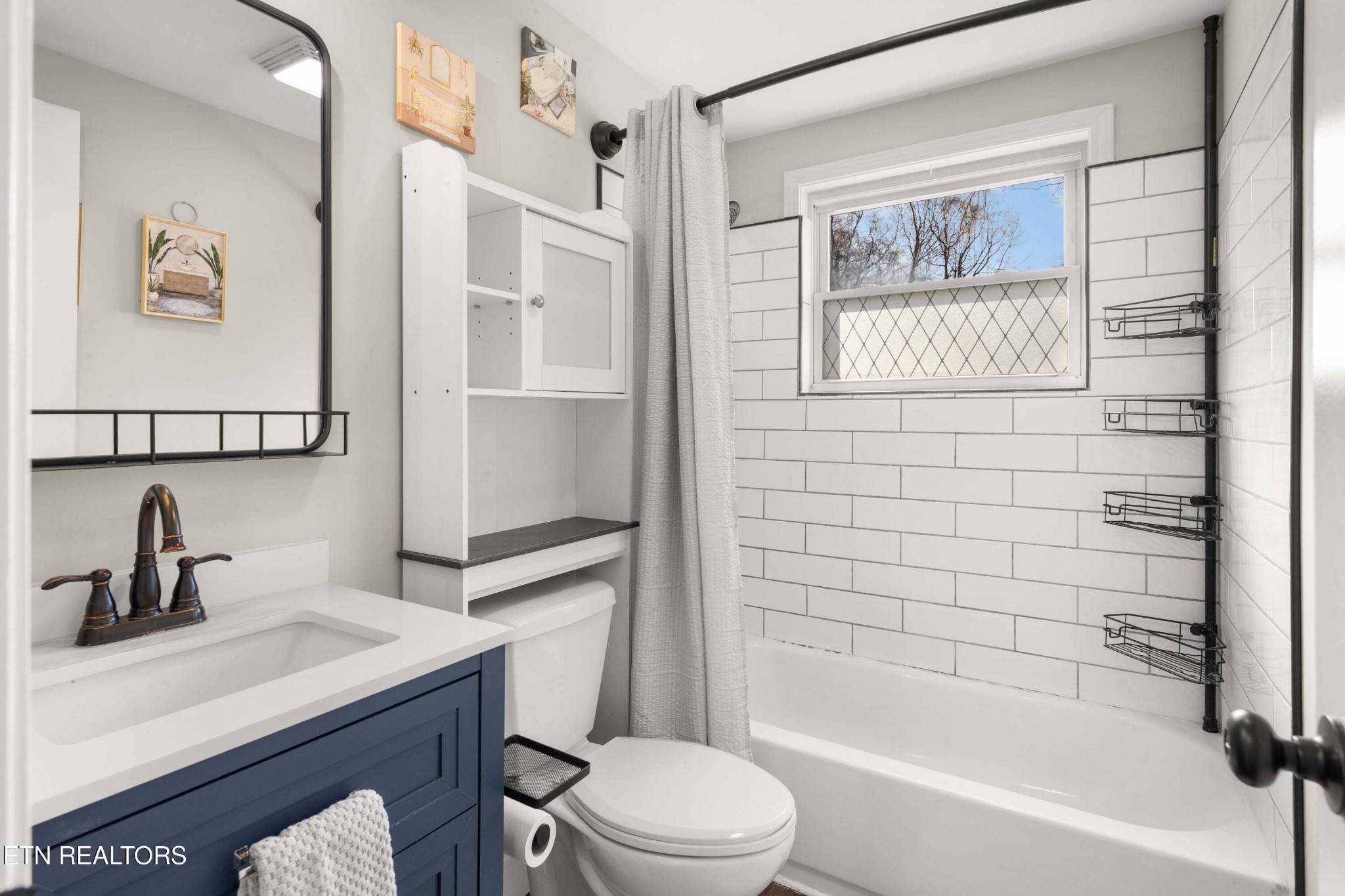 507 Short Street Athens, TN 37303 - Photo 6 of 54 a bathroom with a sink toilet and shower