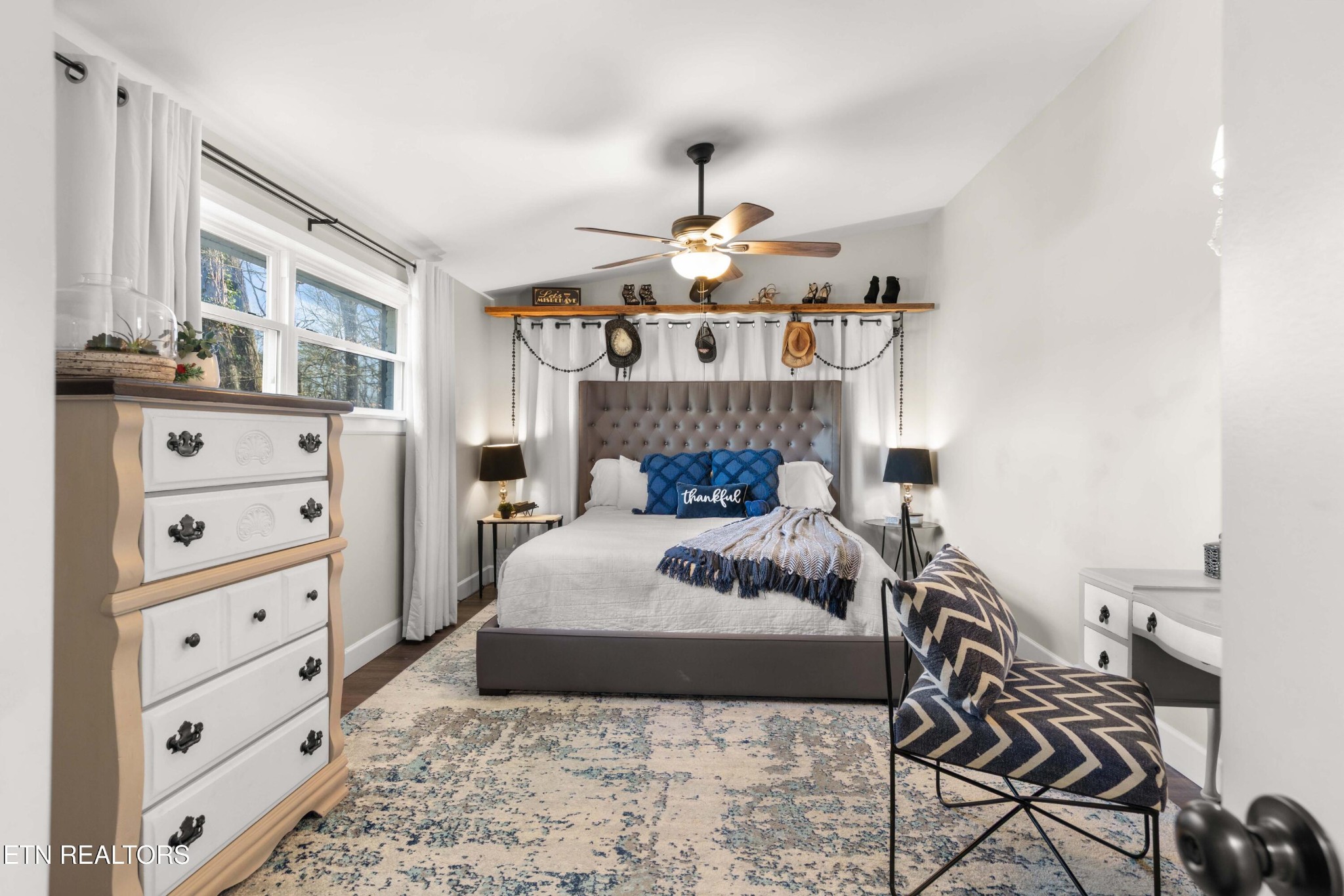 507 Short Street Athens, TN 37303 - Photo 10 of 54 a bedroom with a bed and wooden cabinets