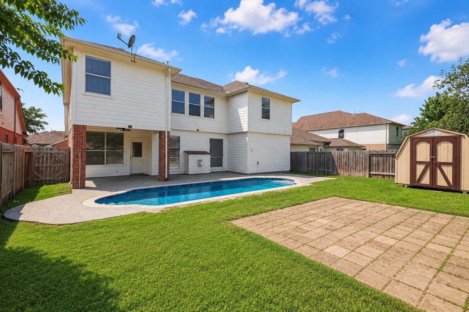 22310 Lamaster Lane Spring, TX 77373 - Photo 4 of 37 A view from the back of the yard. Set up an outdoor living space with umbrella on the pavers and you're set!