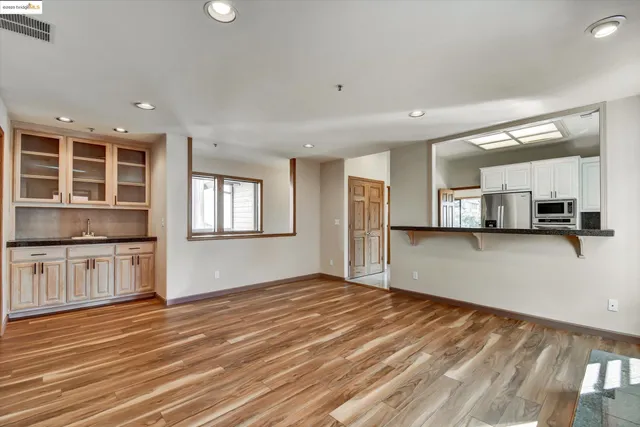 a view of a kitchen with a sink and a stove top oven