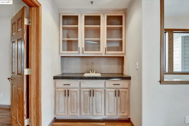 a view of granite countertop cabinets and a stove