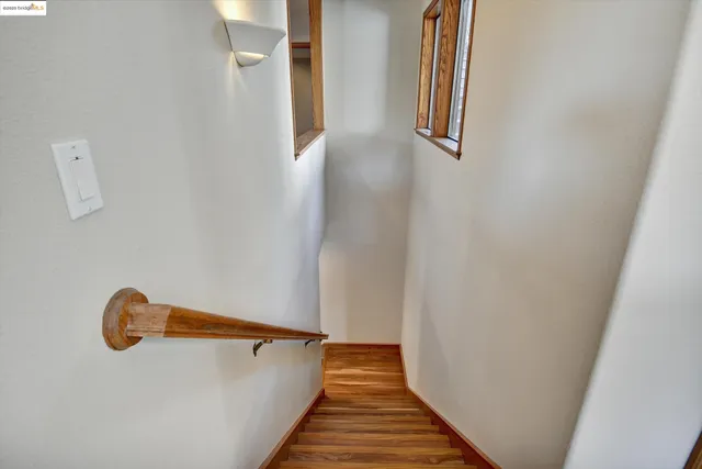 a view of a hall with wooden floor
