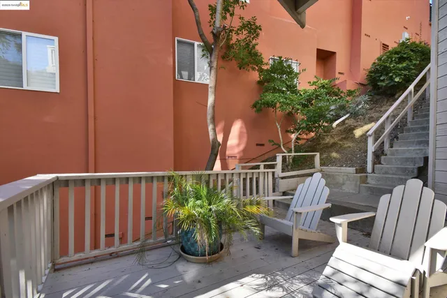 a view of a chair and table in the balcony
