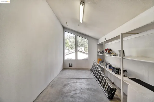 a hallway with windows and stairs