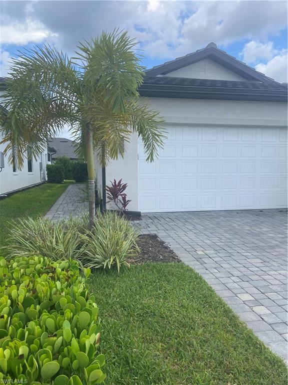 14866 Loggerhead Drive Naples, FL 34120 - Photo 2 of 16 a view of a yard