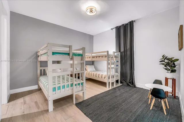 a bedroom with furniture and a window