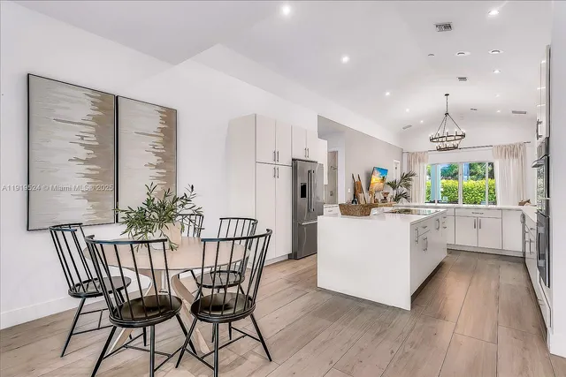a dining room with furniture and wooden floor