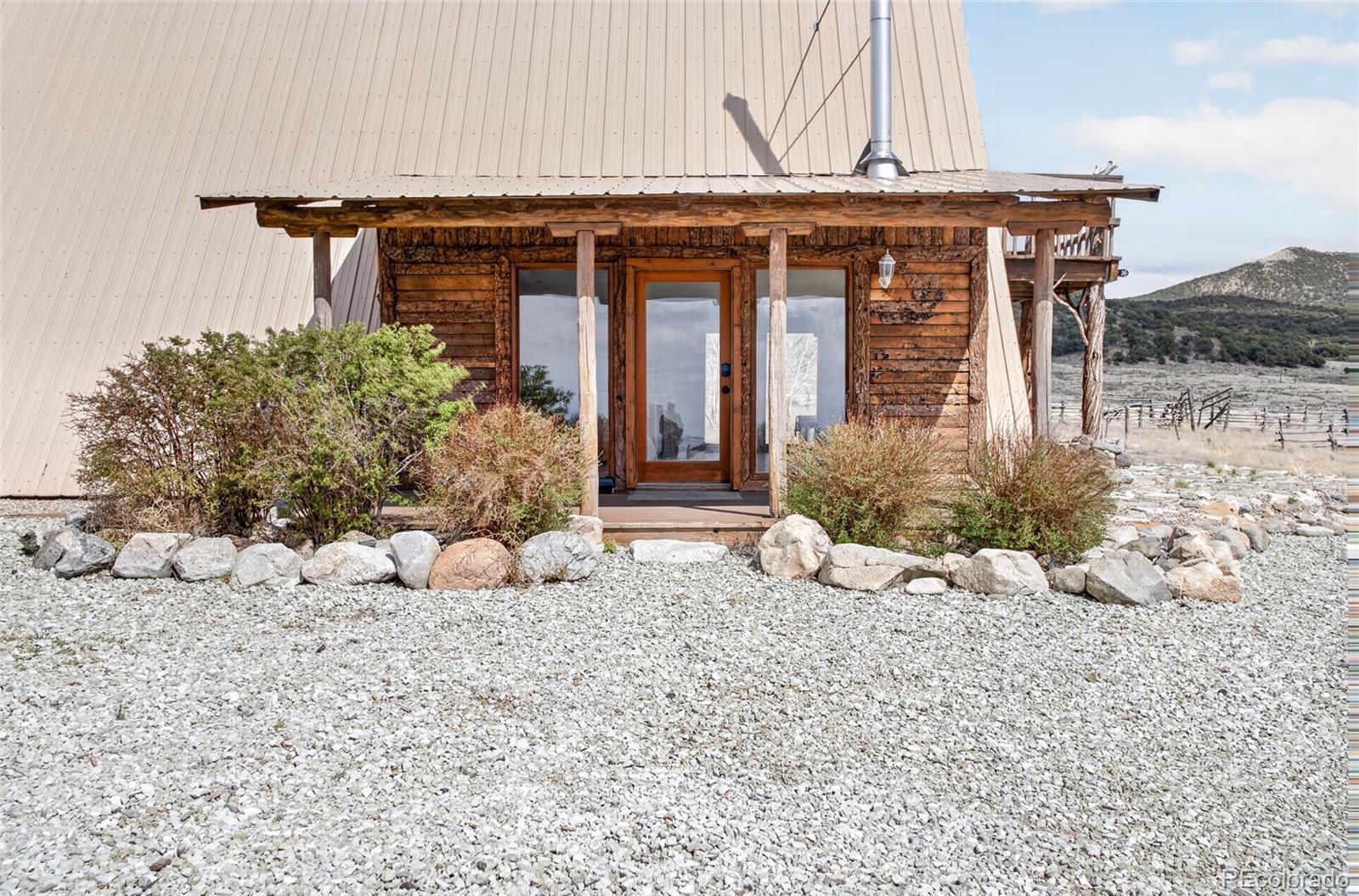 34425 County Road Alamosa, CO 81101 - Photo 2 of 34 a view of a house with a yard and sitting area