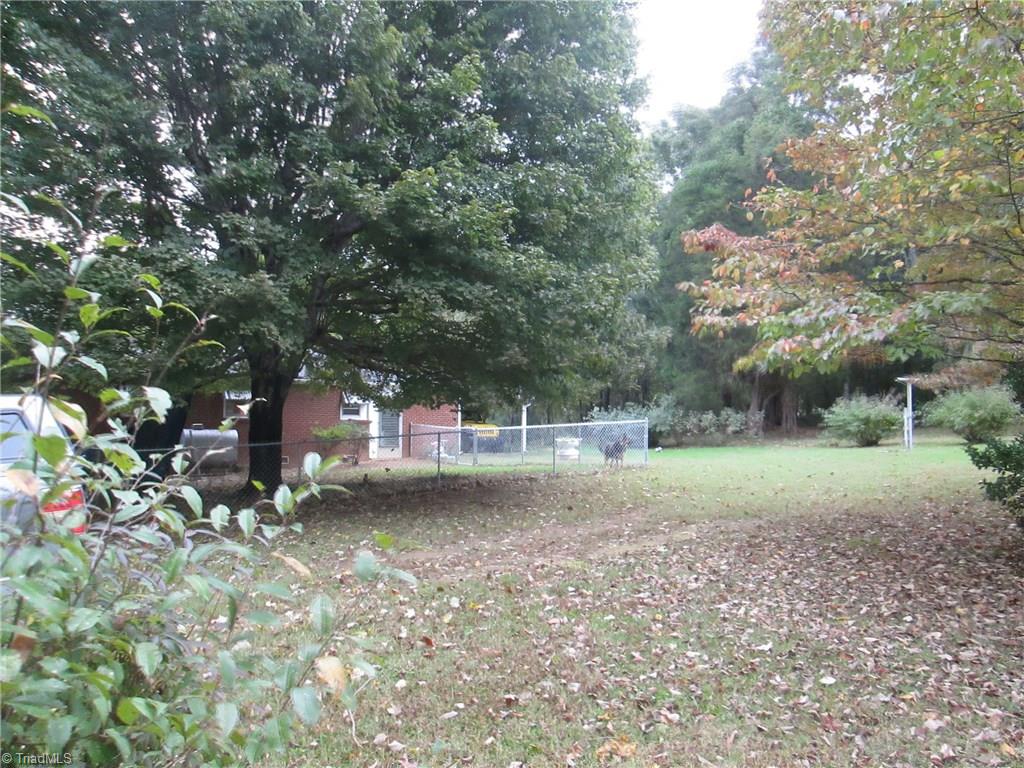 3778 Swicegood Road Linwood, NC 27299 - Photo 15 of 15 back side of home with fencing for dogs