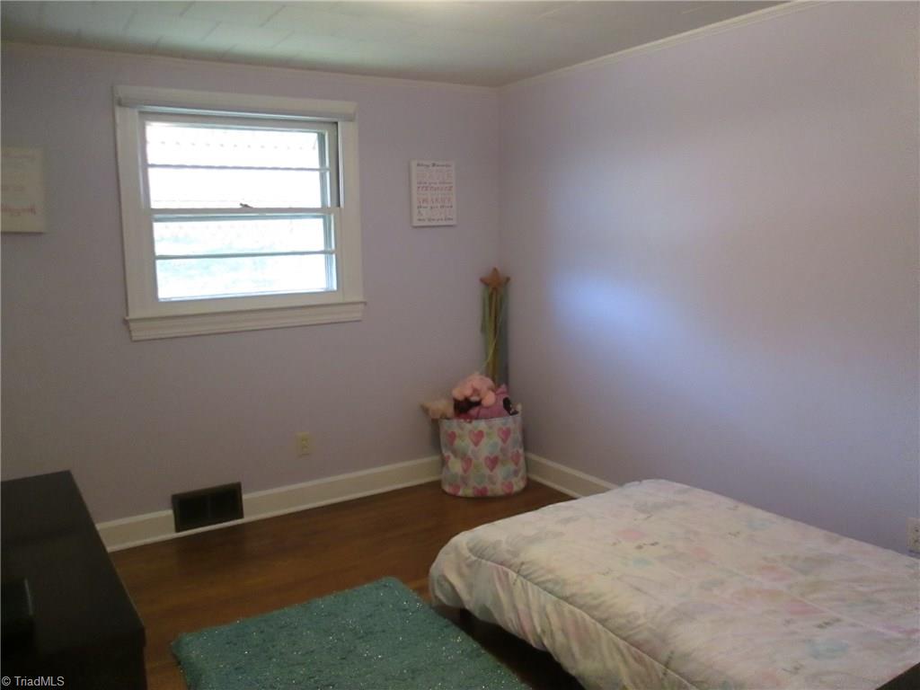 3778 Swicegood Road Linwood, NC 27299 - Photo 7 of 15 3rd bedroom with hardwood floors and new paint