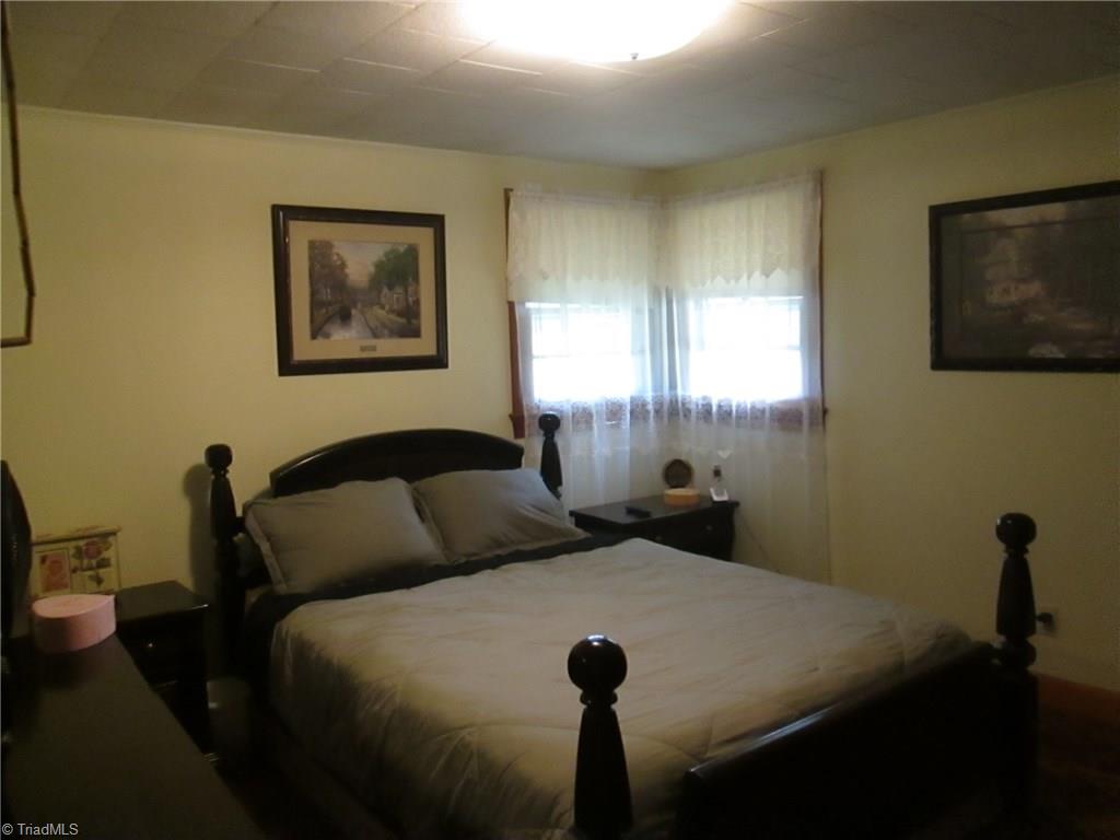 3778 Swicegood Road Linwood, NC 27299 - Photo 8 of 15 Master bedroom with hardwood floors