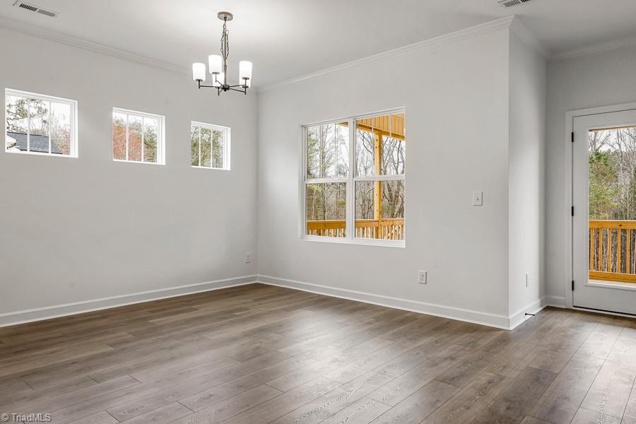 7714 Sedgewick Ridge Road Lewisville, NC 27023 - Photo 14 of 43 Great Dining Space w/ High Windows for Privacy from Neighbors and potential for additional furniture on that wall